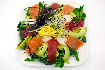 Asian seafood salad. Tuna, salmon, shrimp, avocado and salad. Megeve.France.