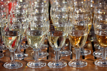 Buffet with glasses of white wine.