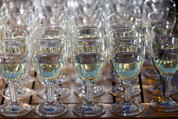 Buffet with glasses of white wine.