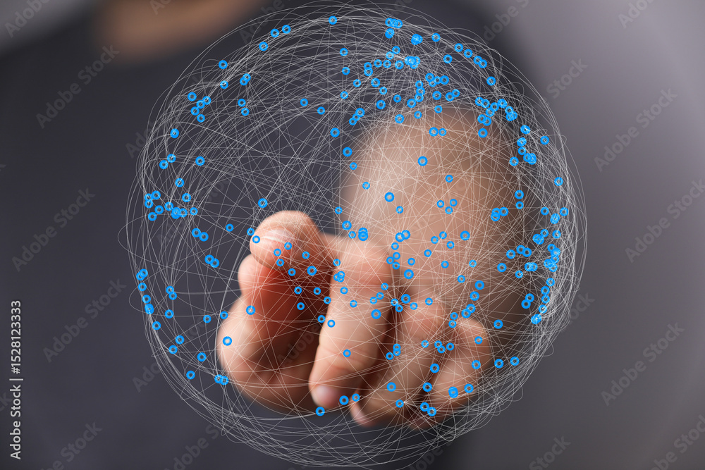 Aufkleber Abstract image of a hand interacting with a digital sphere representing global network connections.