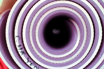 Fitness room. Gym equipment for exercise, rolled yoga mat.