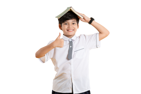 Portrait of Asian kid boy wearing school uniform and holding book posing on  png background	
