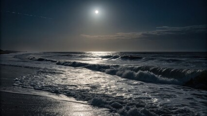Obraz premium Moonlight reflecting on ocean waves at night