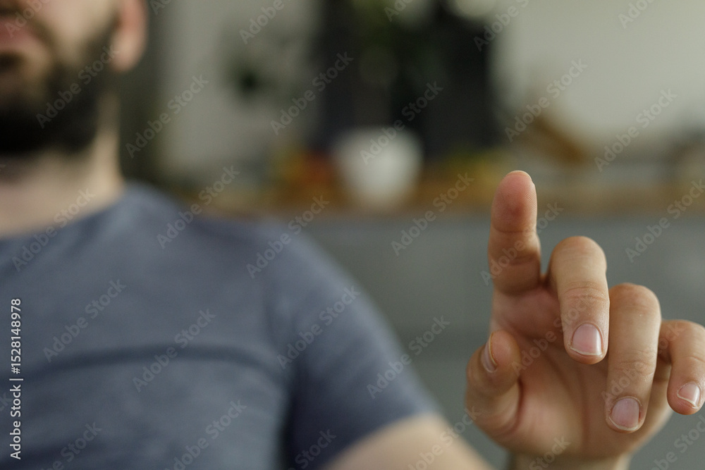Poster Close-up of a man's hand interacting with a digital interface.  Perfect for technology, innovation, and user experience concepts.