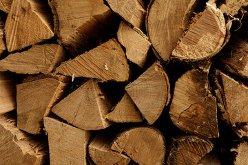 Close-up of neatly stacked firewood, perfect for winter themes, rustic backgrounds, or nature...