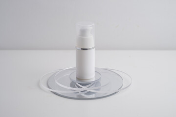 Container for cream, shampoo, toiletries, spa. Unbranded white plastic bottles. Bottle with a dispenser for cosmetic products. Skin care and beauty concept. Mockup style, copy space