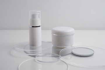 Container for cream, shampoo, toiletries, spa. Unbranded white plastic bottles. Bottle with a dispenser for cosmetic products. Skin care and beauty concept. Mockup style, copy space