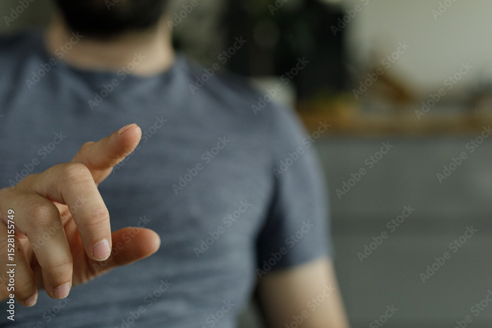 Poster close-up of a man's hand pointing, ideal for presentations or technology concepts.