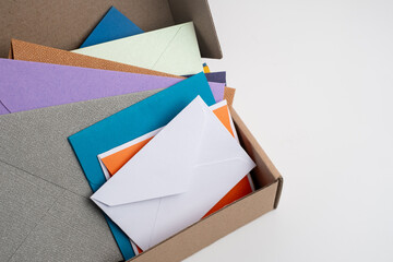 Paper envelopes on a light background. New mail, write a message. Send and receive mail. Postal delivery service. Empty envelope, empty space. Communication with people, paperwork. Envelope close-up