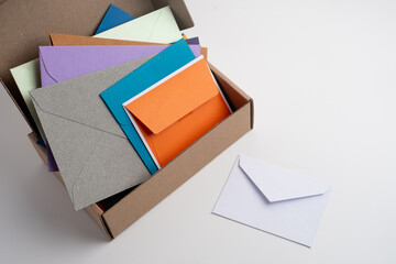 Paper envelopes on a light background. New mail, write a message. Send and receive mail. Postal delivery service. Empty envelope, empty space. Communication with people, paperwork. Envelope close-up