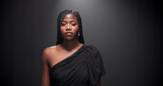 Studio, black woman and face with walking for runway, event and presentation of fashion with mockup. Female person, model and portrait with pride for clothing show, designer dress and dark background