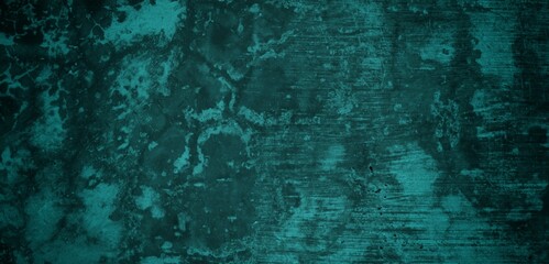 A textured background featuring a deep teal color with a distressed, grunge appearance. The surface shows variations in tone and subtle patterns, creating an abstract and moody aesthetic.