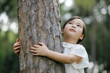 Child Hugging Tree Promoting Forest Conservation