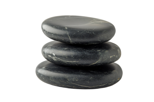 Three smooth, dark grey stones stacked on top of each other, creating a sense of balance and tranquility.  