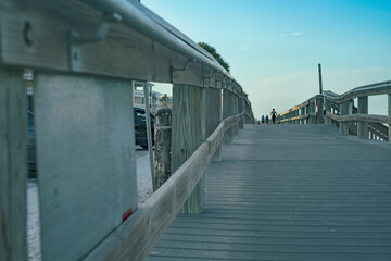 Wooden boardwalk leading to the beach horizon