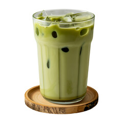 Refreshing glass of iced matcha latte with ice cubes served on a wooden coaster