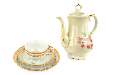Elegant vintage porcelain coffee pot, porcelain cup and saucers isolated on white background.