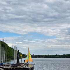 Sailboats Gently Gliding on a Tranquil Lake Beneath Beautiful, Dramatic Skies Above Maschsee...