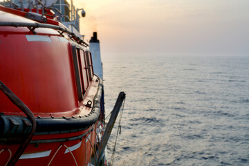 Lifeboat in a cable ship underway at sea in the morning