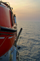 Lifeboat in a cable ship underway at sea in the morning