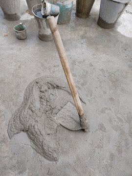 shovel cement mix with sand and water stock photo