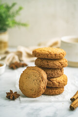 Homemade peanut or almond butter cookies or oatmeal cookies on white kitchen background. High quality photo