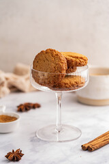 Homemade peanut or almond butter cookies or oatmeal cookies on white kitchen background. High quality photo
