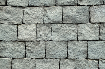 New  gray  andesite stone wall closeup