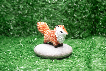 Stylized miniature fox on grass