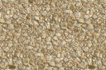 Seamless Old Stone Wall Texture in Warm Tones, Ideal for Rustic and Ancient Architectural Backgrounds