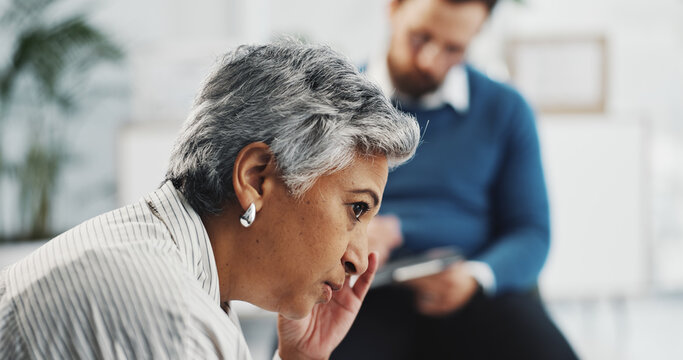 Anxiety, therapy and psychologist with old woman in office for counseling, stress and appointment. Mental health session, support and trauma guidance with people in clinic for recovery and advice