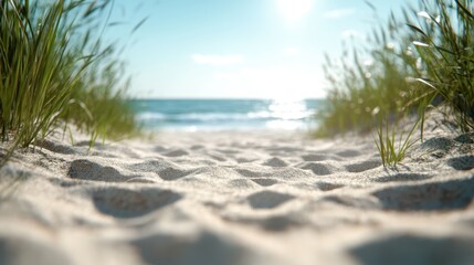 A tranquil scene showcasing a sandy pathway framed by seaside grass that leads directly to the luminous and serene ocean waves, perfect for evoking a sense of calm.