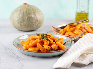 Pumpkin recipe homemade gnocchi on pastel color background