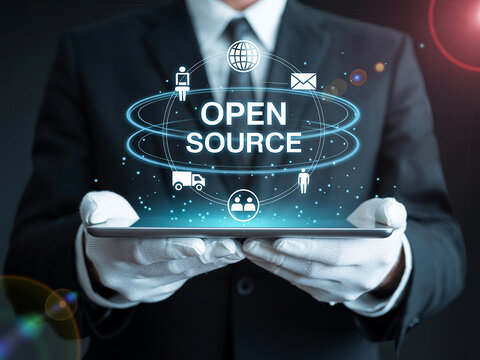 Businessman Holding Tablet Showing Open Source Concept