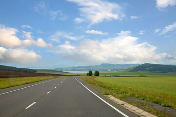 Highway outside the city among the fields