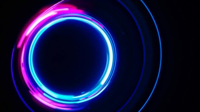 Colorful neon circles are rotating and pulsating on a black background, creating a vibrant and dynamic visual effect, perfect for any project that needs a touch of energy and excitement