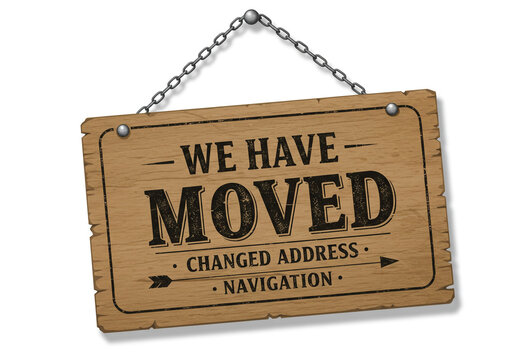A wooden sign hanging from a chain that says we have moved changed address navigation on it