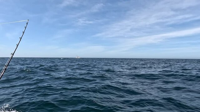 Cabo San Lucas Mexico fishing boat horizon. Cabo, a resort city at southern tip of the Baja California peninsula. ocean destination vacation and business.