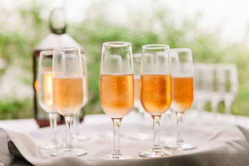 Sparkling drinks served elegantly at a celebration during a sunny outdoor gathering