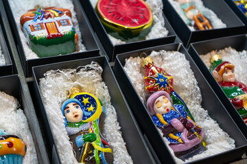 Storage of glass Christmas tree toys in a box. Christmas decorated packaging.