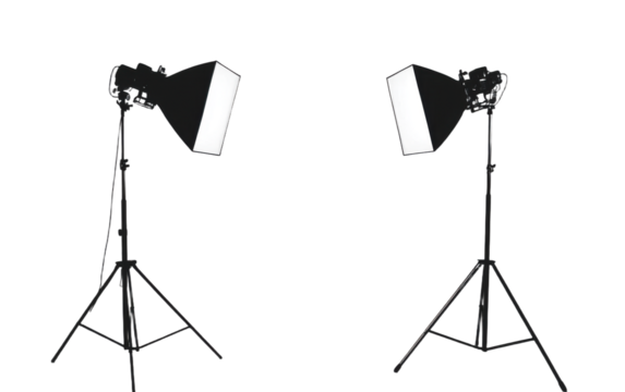 Two black and white lighting stands with a white background