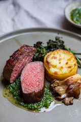 Fillet steak with potato stack, oyster mushrooms and chimichurri sauce