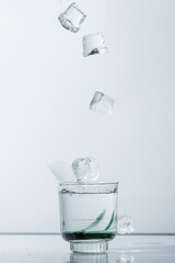 Refreshing Cocktail with Falling Ice Cubes