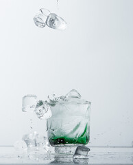 Refreshing Cocktail with Falling Ice Cubes
