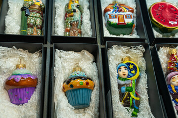 Storage of glass Christmas tree toys in a box. Christmas decorated packaging.