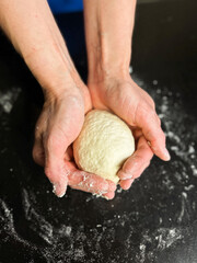 Homemade sourdough without yeast or gluten in woman hands. Ideal for allergy friendly diets, and natural food ads.