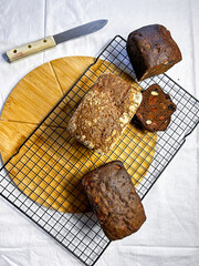 Flat lay on white background of healthy homemade bread served on table.
