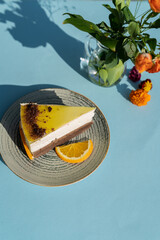 Piece of cake on a plate outdoor on a sunny day