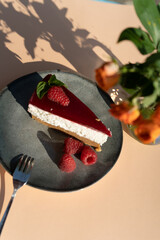 Piece of cake on a plate outdoor on a sunny day