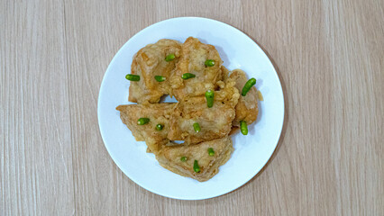 Crispy fried tofu, healthy cooking soybean block tofu in white plate and chilli